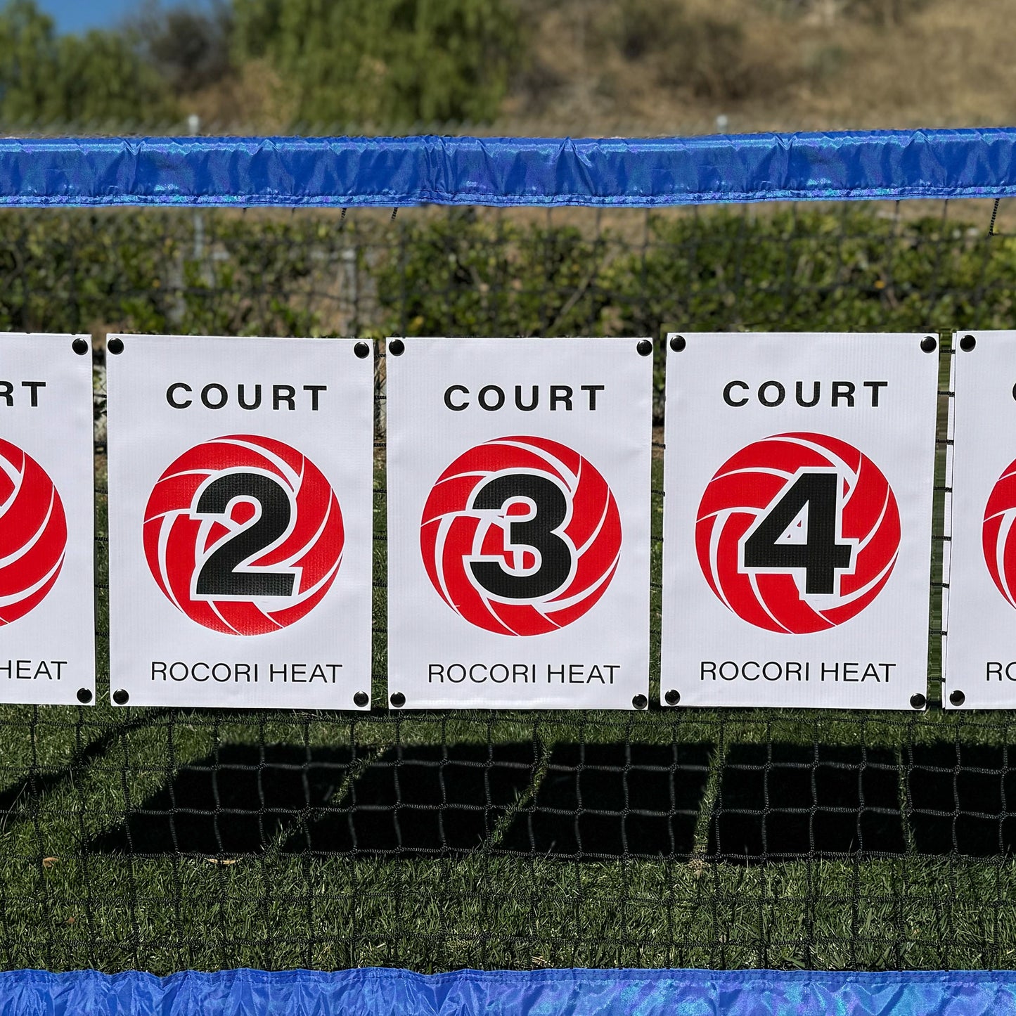 Get customized net banner signs for volleyball, pickleball, tennis, and more! Personalize with logos, colors, and text. Durable, weatherproof, and perfect for teams & events. Order now at printonthis.com!