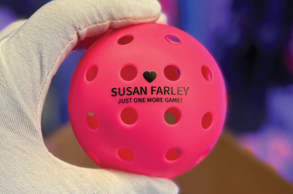 Custom-printed pickleball with a personalized name, ideal for gifts and tournaments.