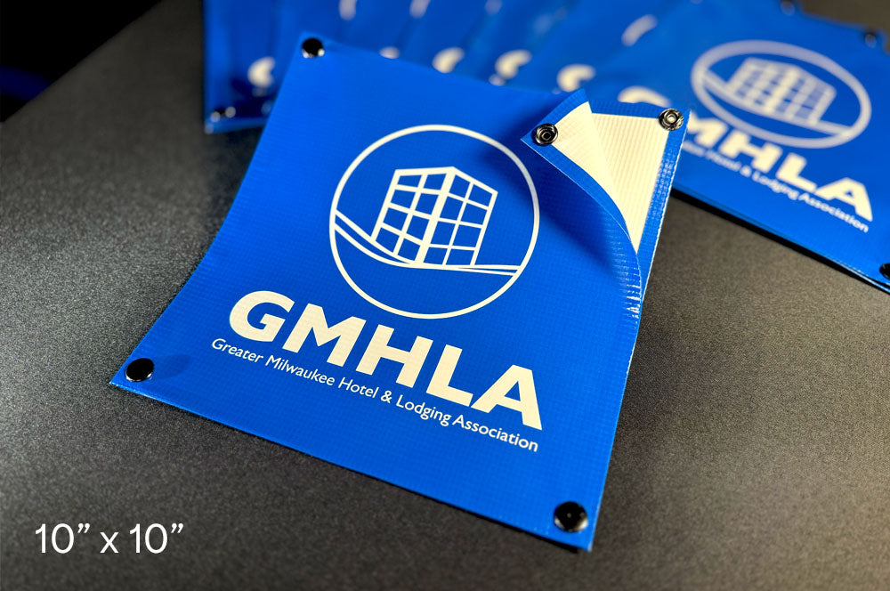 Custom snap-on net sign featuring GMHLA logo for Greater Milwaukee Hotel & Lodging Association, printed on 10x10 inch blue vinyl banner