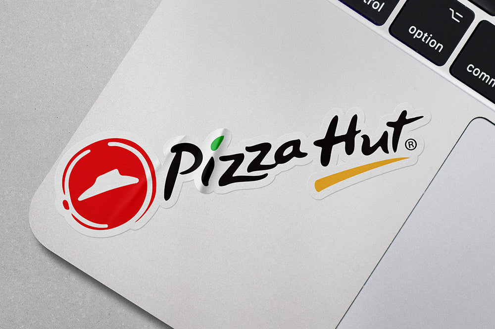 Vinyl die-cut sticker applied to a laptop, featuring clean edges and a glossy finish.