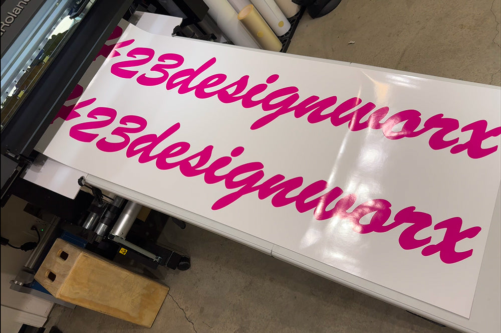 Large vinyl lettering being printed, perfect for business signage or wall decals.