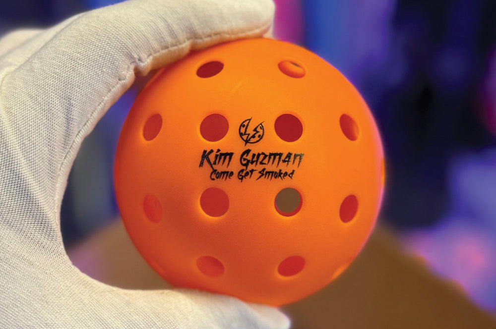 Orange pickleball with a custom-printed sports gift design for tournaments or events.